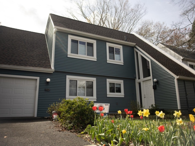 Reston home with blue vinyl installed by Presidential Exteriors